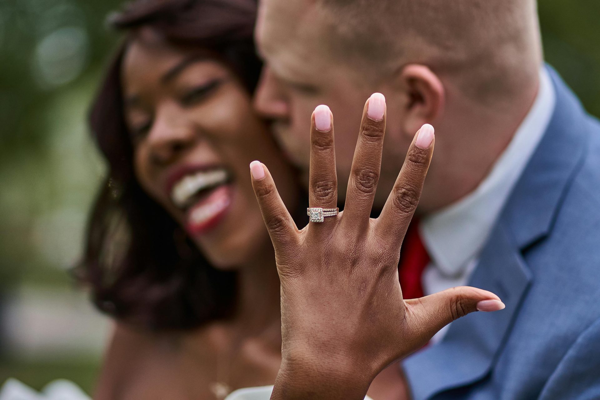 Engaged couple showing their ring Engaged couple
